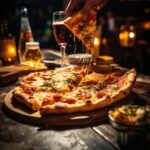 person-is-eating-pizza-with-fork-glass-wine_662214-45062